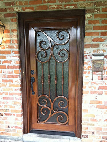 single wood door with swirls