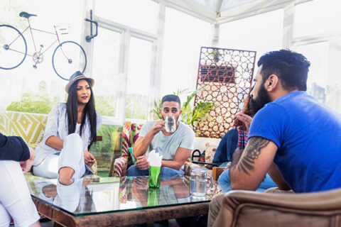 group of people having a talk in garden area