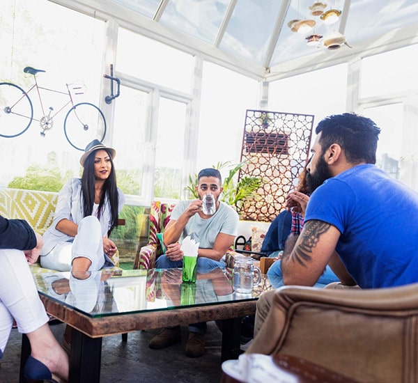 group of people having a talk in garden area